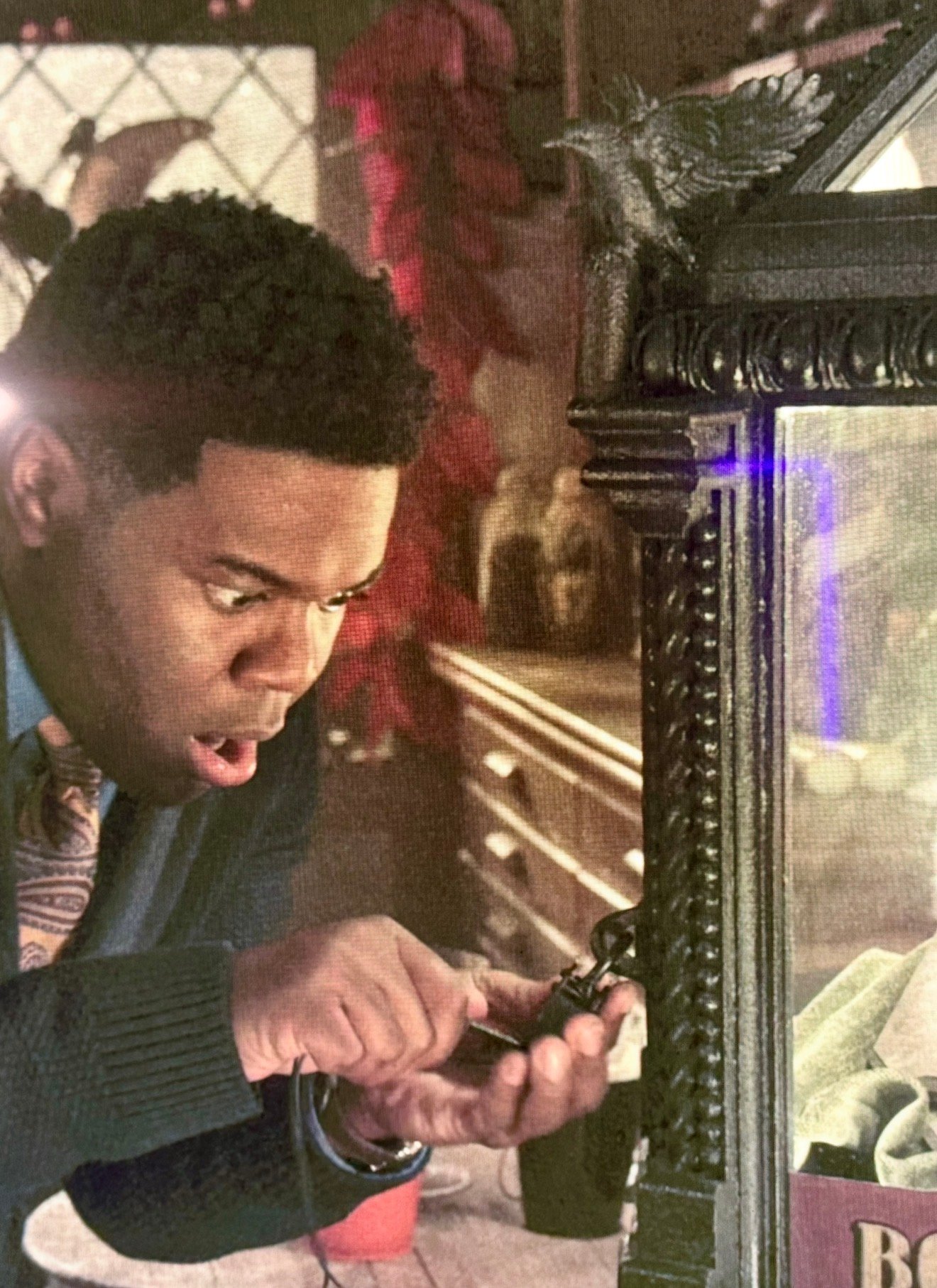 Actor examining Primitive Witchery work on set of Hocus Pocus 2